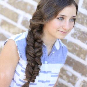 Young woman standing outside modeling Alternative Braid