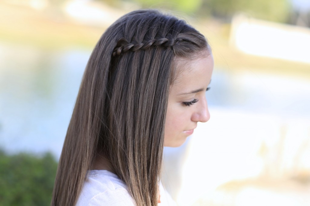 Young girl outside modeling Four-Strand Waterfall Braid