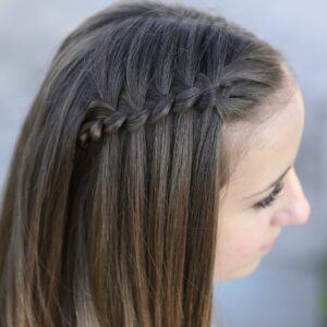 Young girl outside modeling Four-Strand Waterfall Braid