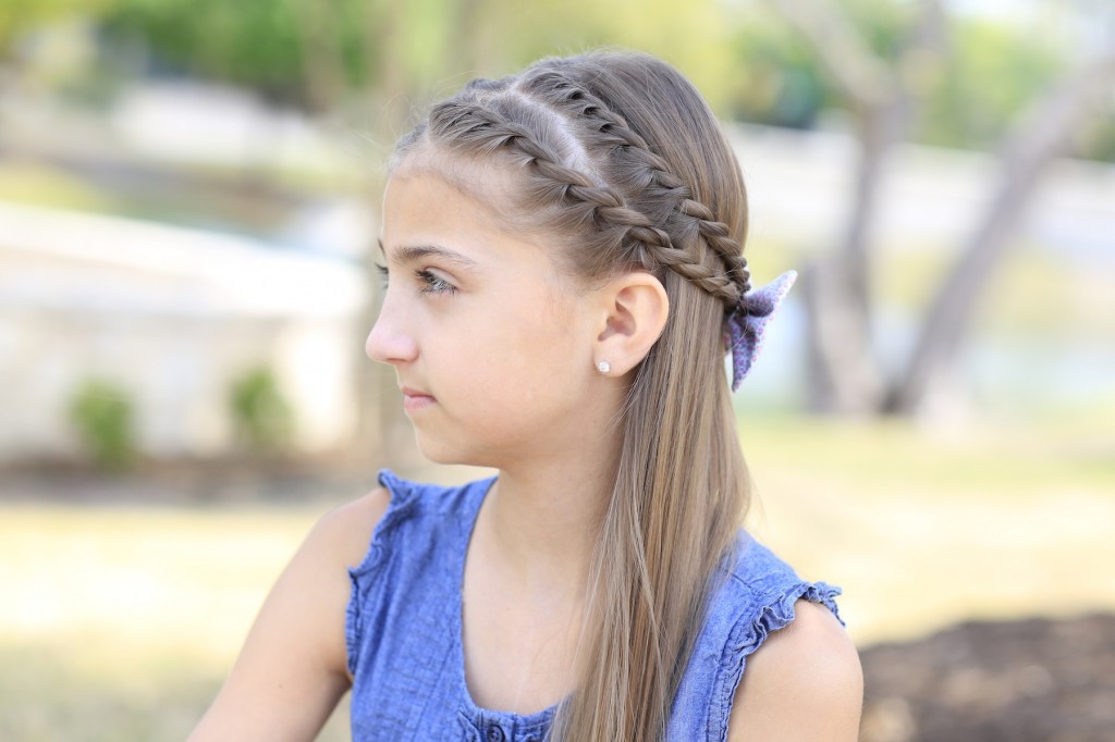 Young girl outside modeling Rope Braid Tieback Hairstyle