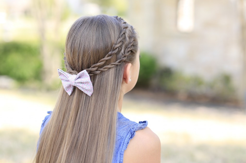 Young girl outside modeling Rope Braid Tieback Hairstyle