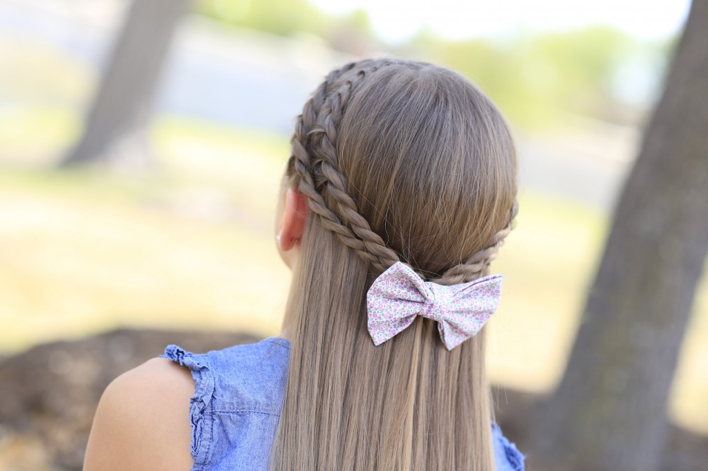 Young girl outside modeling Rope Braid Tieback Hairstyle