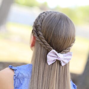 Young girl outside modeling Rope Braid Tieback Hairstyle