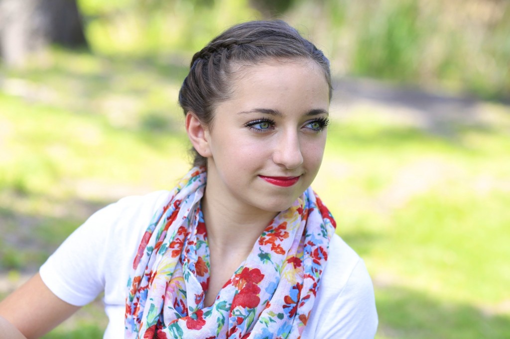 Young girl outside modeling Laced Fishtail Braid