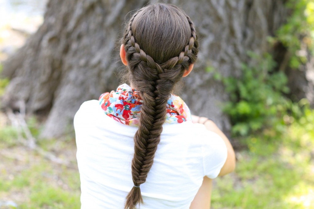 Young girl outside modeling Laced Fishtail Braid