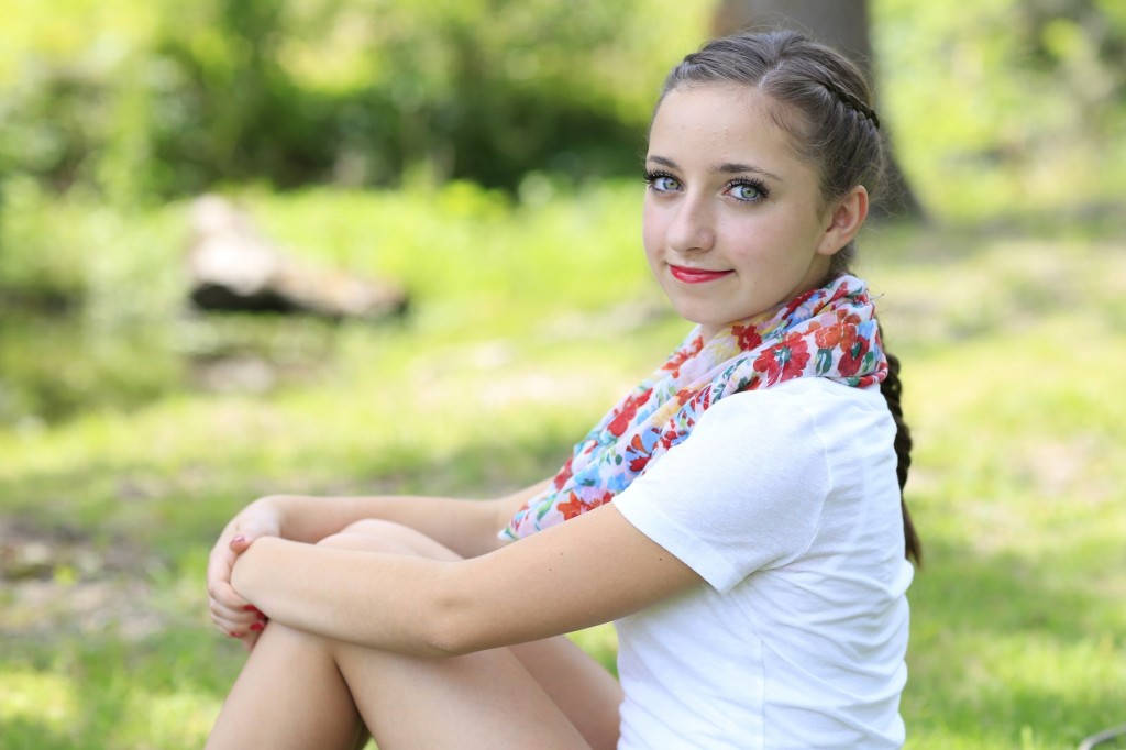 Young girl outside modeling Laced Fishtail Braid