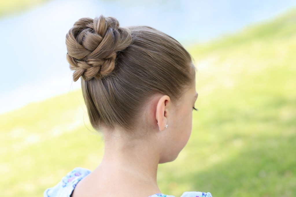 Little girl sitting outside modeling 3D Flower Bun Updo