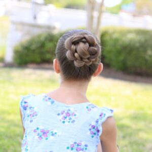 Little girl sitting outside modeling 3D Flower Bun Updo