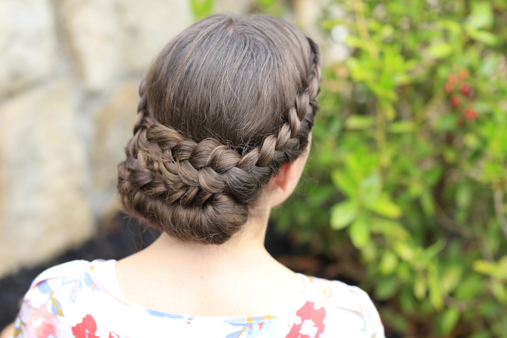 Young girl outside modeling Lace-Rolled Updo Hairstyle (back)