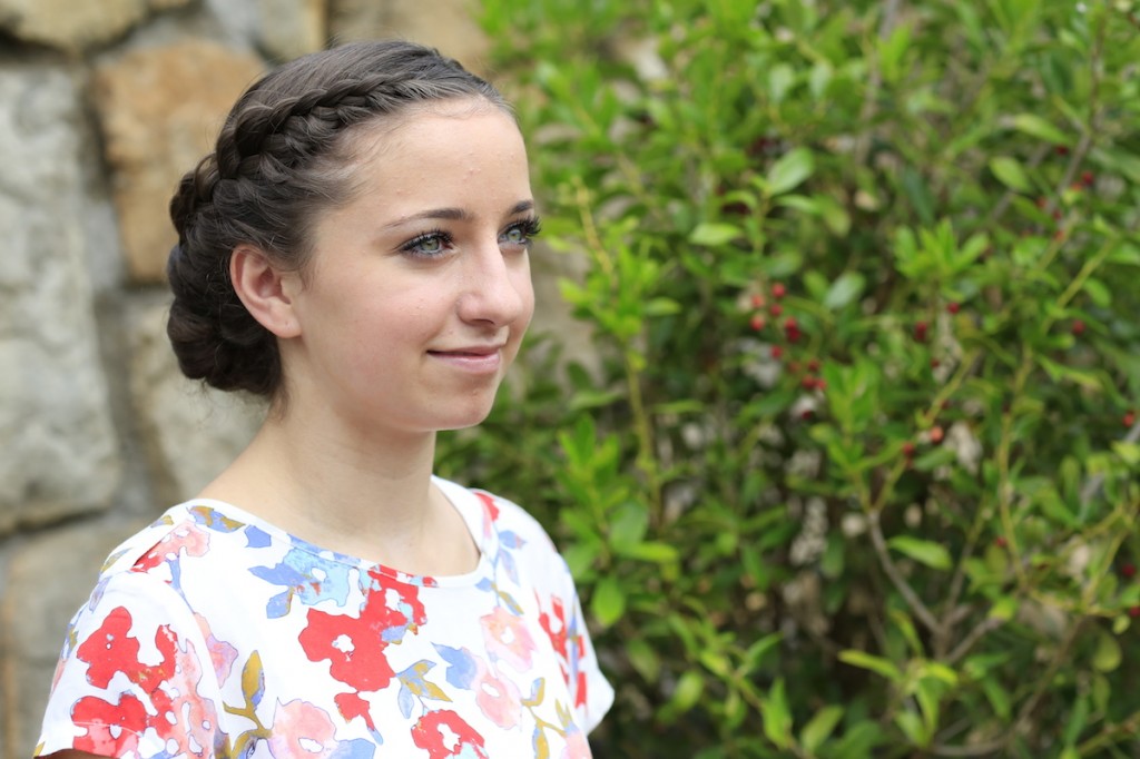 Young girl outside modeling Lace-Rolled Updo Hairstyle