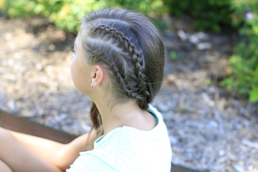 Young girl outside modeling Double Dutchback | Heidi Klum Hairstyles