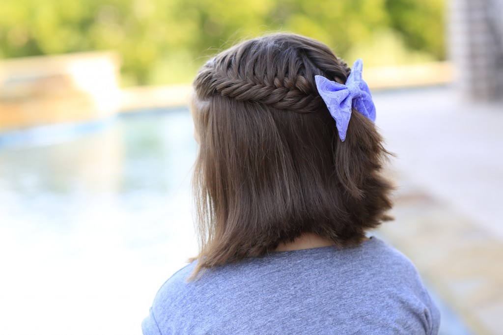 Little girl sitting by the pool modeling Laced Fishtail Tieback