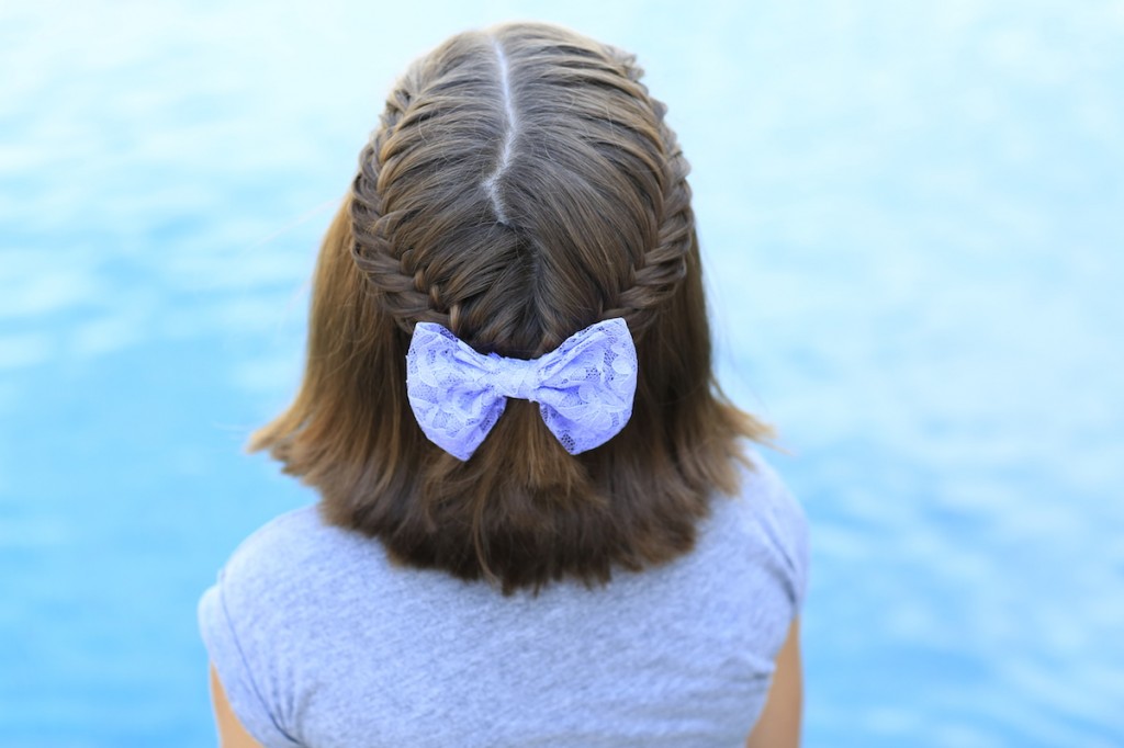 Little girl sitting by the pool modeling Laced Fishtail Tieback