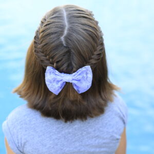 Little girl sitting by the pool modeling Laced Fishtail Tieback
