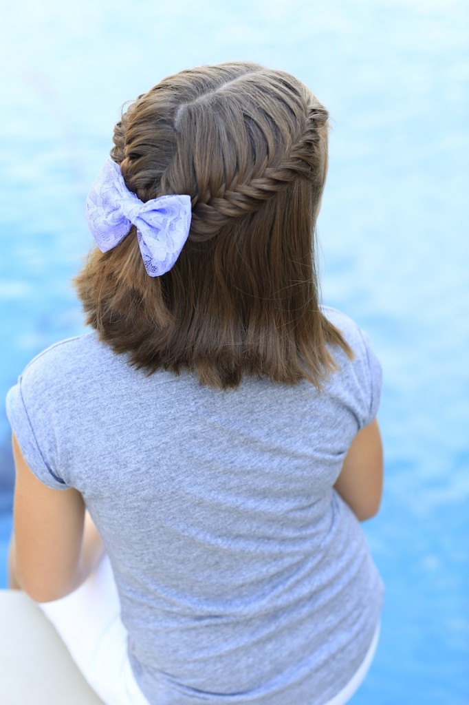 Little girl sitting by the pool modeling Laced Fishtail Tieback