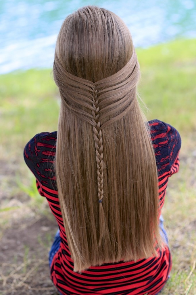 Young girl outside modeling Mermaid Half Braid | Hairstyles for Long Hair (back)