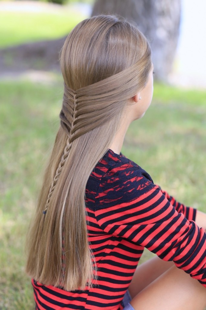 Young girl outside modeling Mermaid Half Braid | Hairstyles for Long Hair