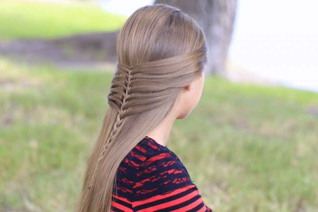 Young girl outside modeling Mermaid Half Braid | Hairstyles for Long Hair