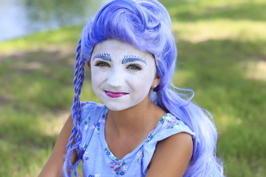 Young girl dressed up as Monster High's Sirena Von Boo | Halloween Hairstyles