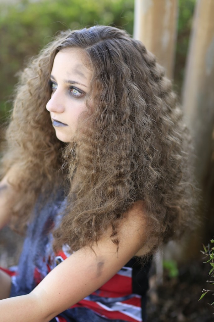 Young girl wearing Zombie Cheerleader costume | Halloween Hairstyles