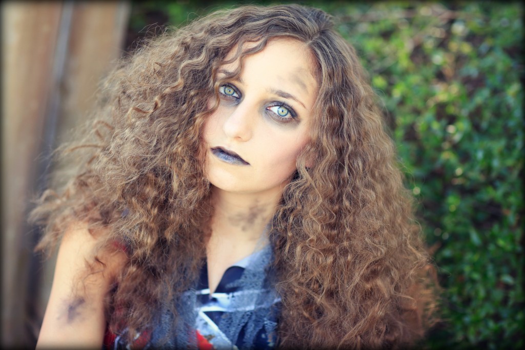 Young girl wearing Zombie Cheerleader costume | Halloween Hairstyles