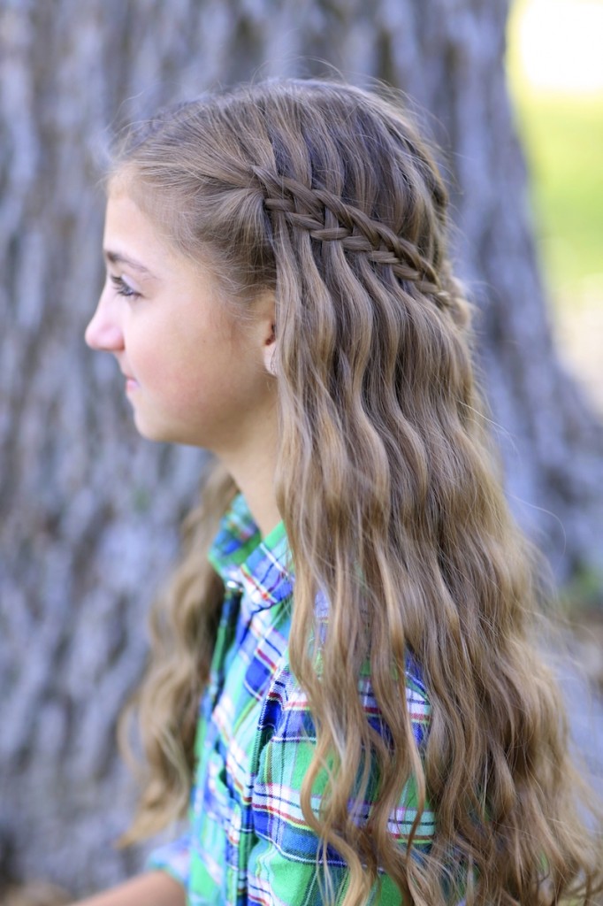 Young girl outside modeling Scissor Waterfall Braid Combo