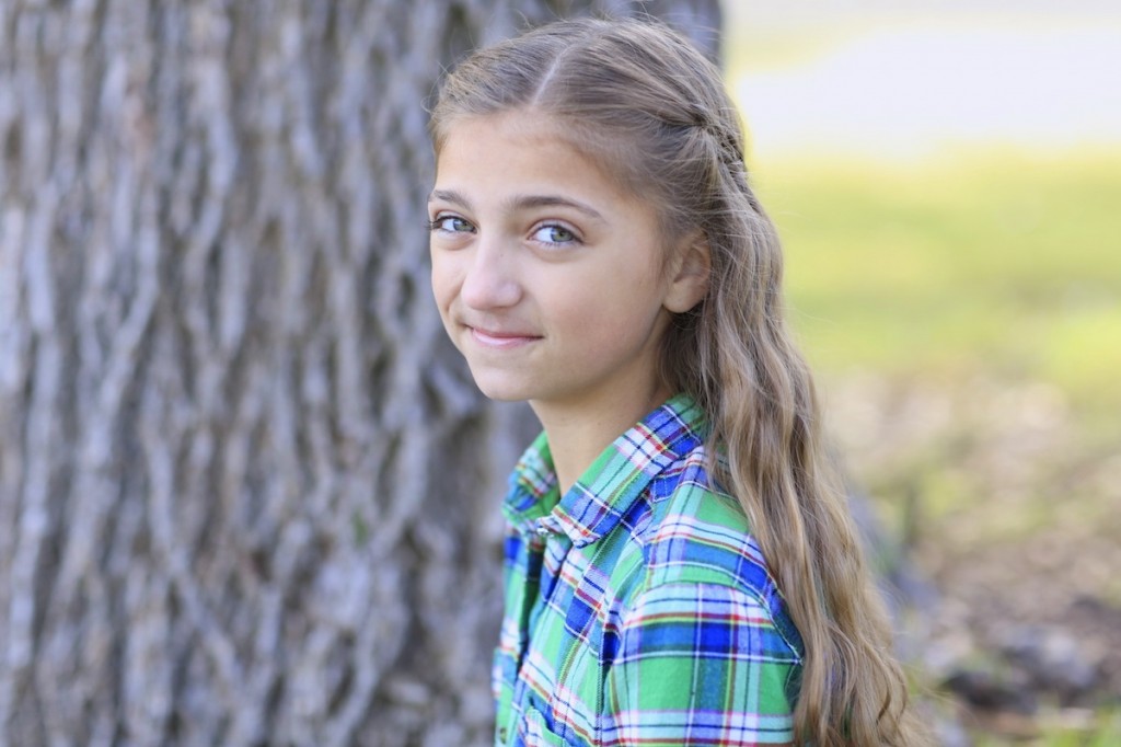 Young girl outside modeling Scissor Waterfall Braid Combo