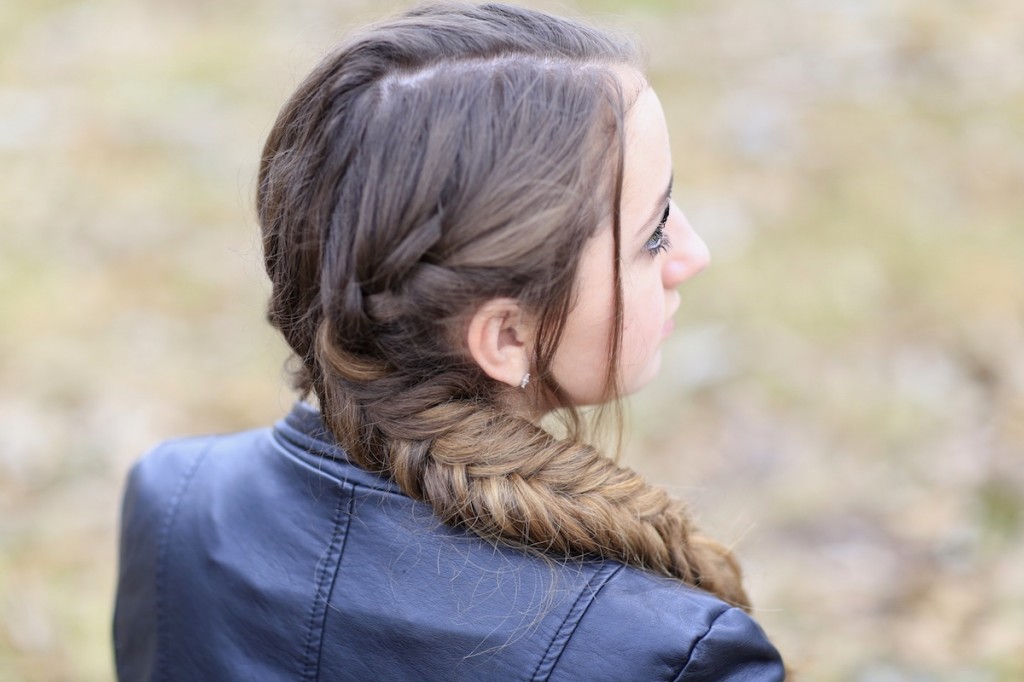 Girl outside wearing a back jacket modeling Katniss' Mockingjay Braid | Hunger Games Hairstyles