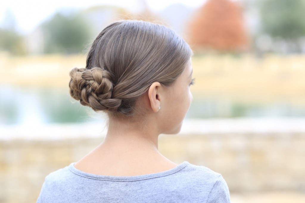 Young girl outside modeling Prim's Braided Updo | Hunger Games Hairstyles