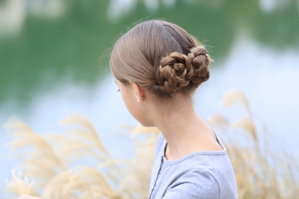 Young girl outside modeling Prim's Braided Updo | Hunger Games Hairstyles