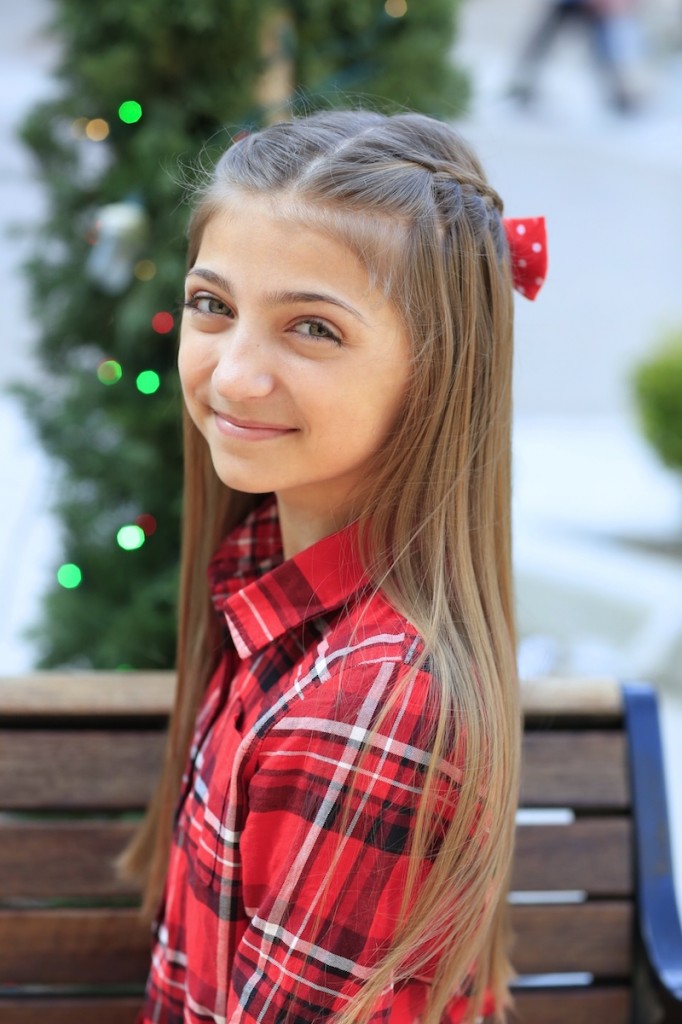 Young girl outside modeling Upward Lace Braid