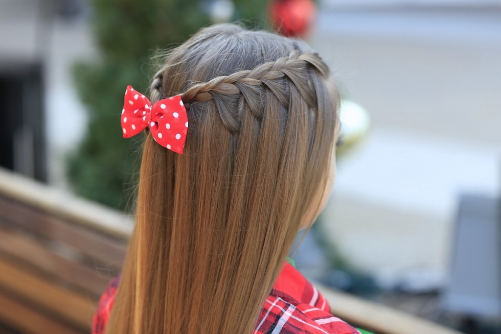 Young girl outside modeling Upward Lace Braid