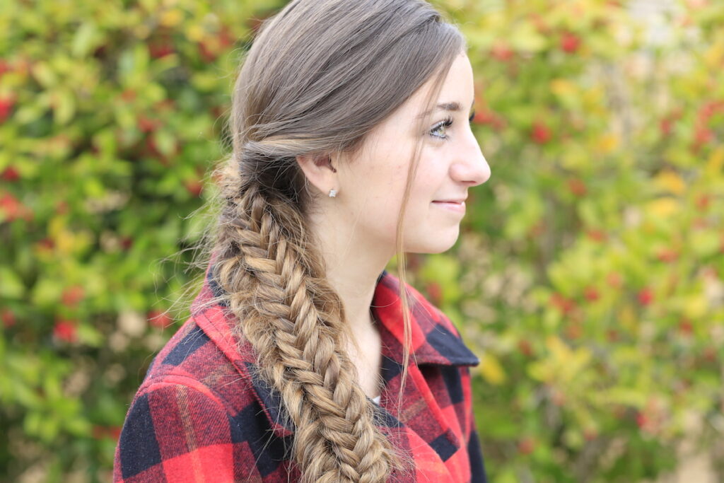 Young girl outside modeling Messy Split Fishtail Braid