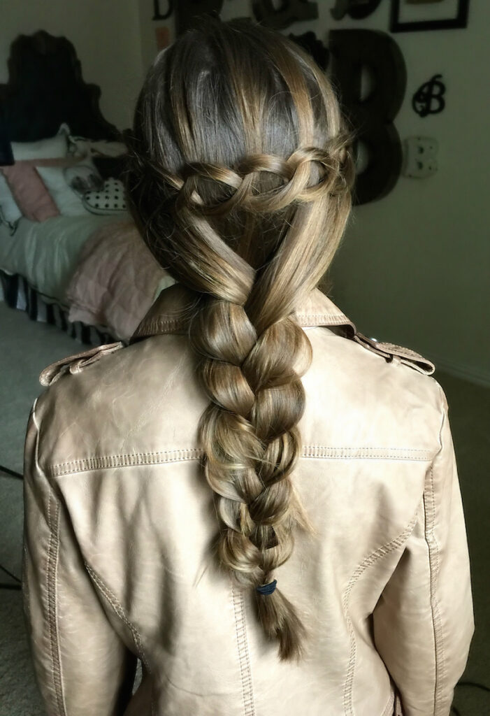 Young girl in her room modeling Loop Waterfall Braid