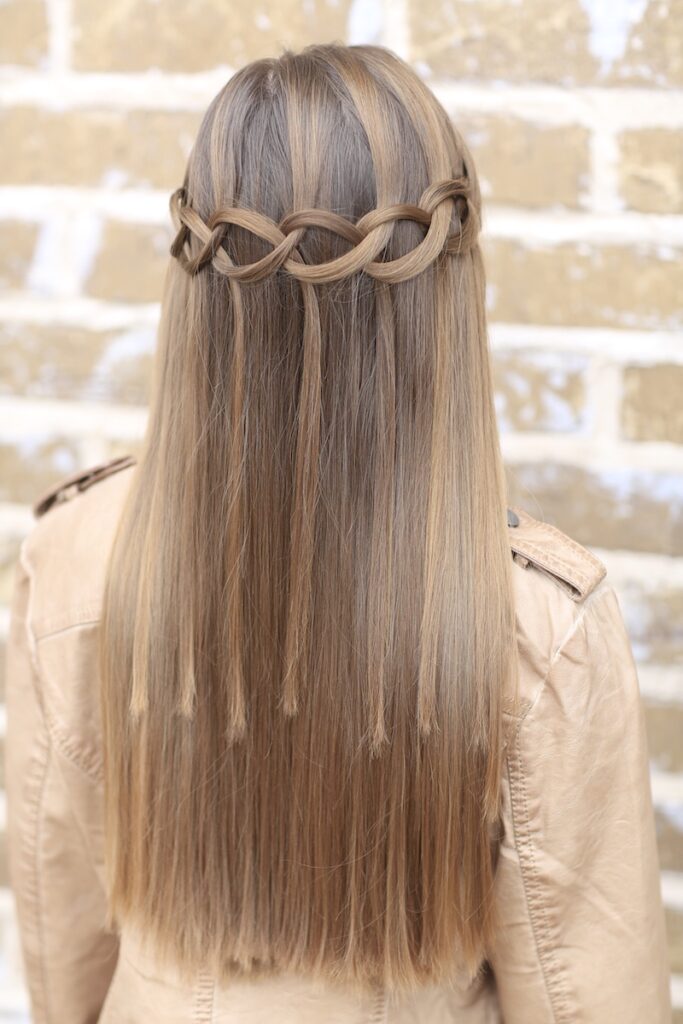 Young girl outside modeling Loop Waterfall Braid