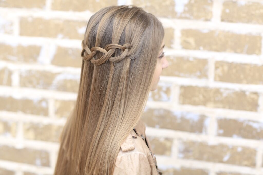 Young girl outside modeling Loop Waterfall Braid