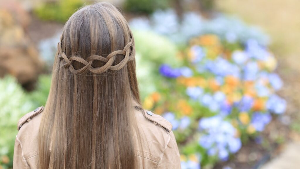 Young girl outside modeling Loop Waterfall Braid