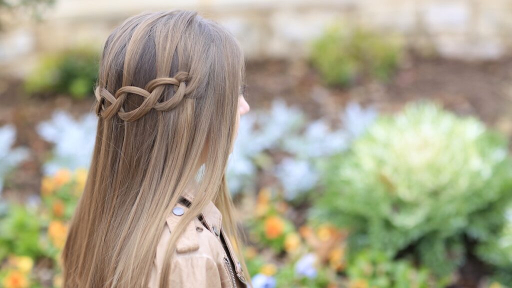 Young girl outside modeling Loop Waterfall Braid