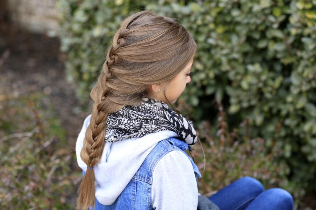 Young girl outside modeling Waterfall Twist & Mermaid Braid Combo