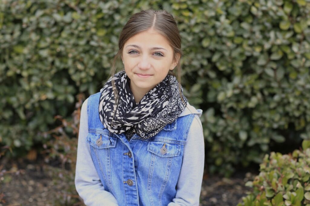 Young girl outside modeling Waterfall Twist & Mermaid Braid Combo