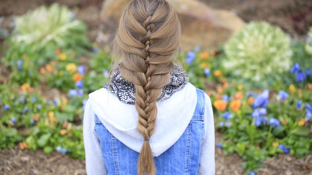 Young girl outside modeling Waterfall Twist & Mermaid Braid Combo