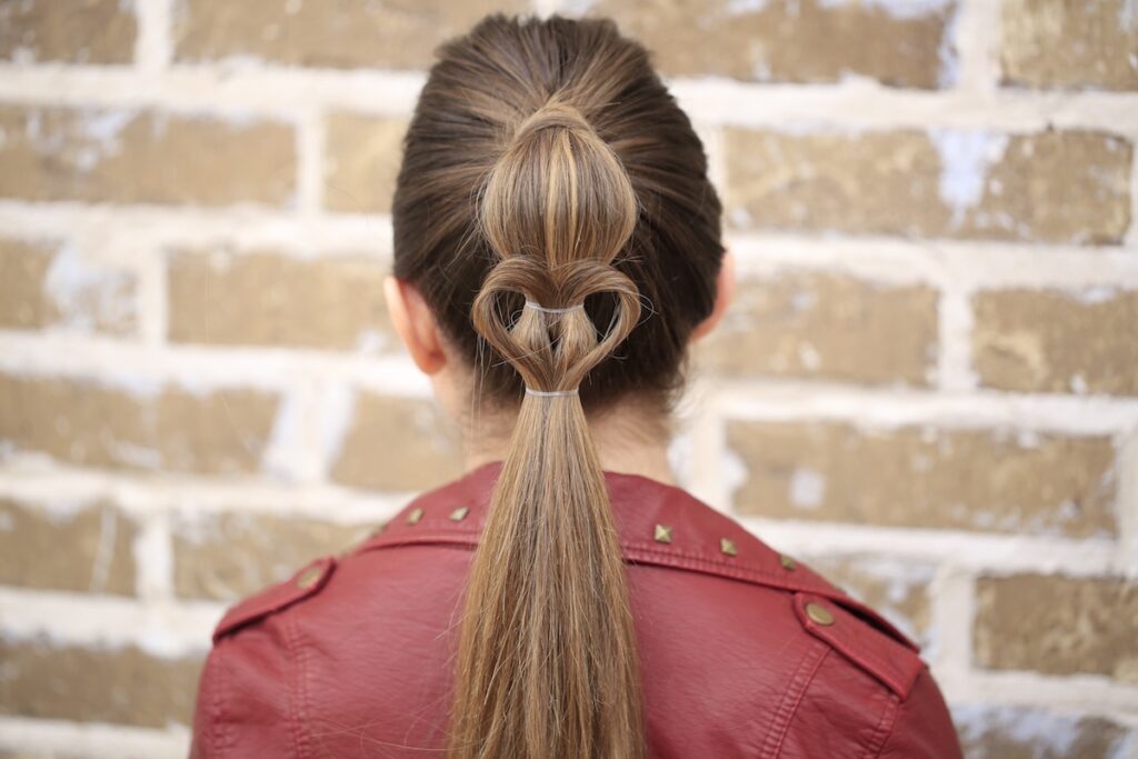 Young girl standing outside modeling Heart Ponytail | Valentine's Day Hairstyles