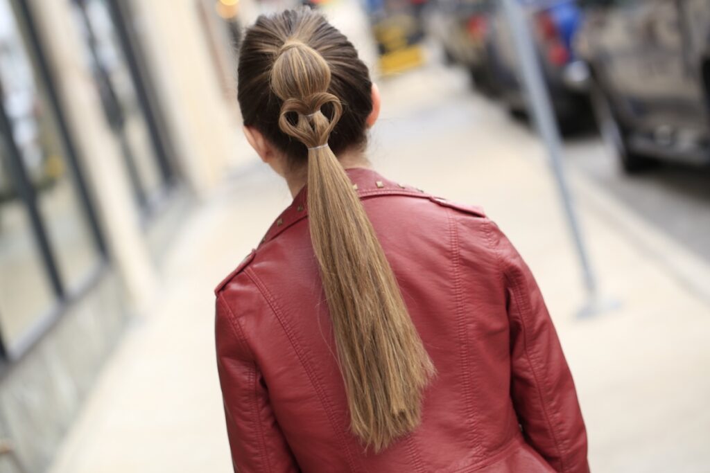 Young girl standing outside modeling Heart Ponytail | Valentine's Day Hairstyles