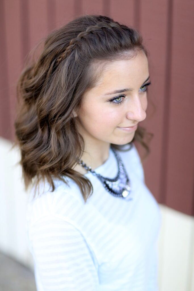 Young girl outside modeling DIY Faux Waterfall Headband