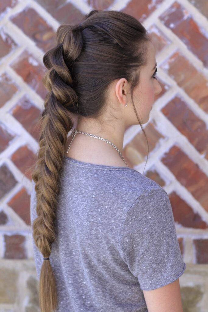 Young girl outside modeling the Pull-Through Fishtail Braid Combo