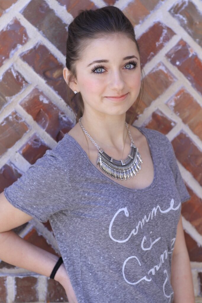 Young girl outside modeling the Pull-Through Fishtail Braid Combo