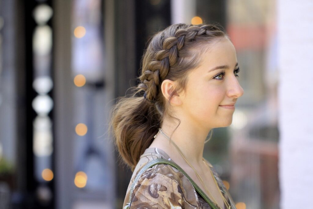 Portrait of young girl outside modeling Dutch Accent Ponytail | Short Hairstyles