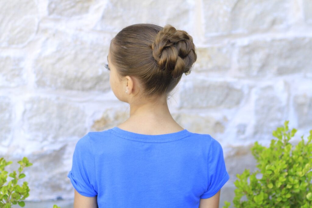 Young girl outside modeling Rope Twisted Bun | Hairstyles for Prom