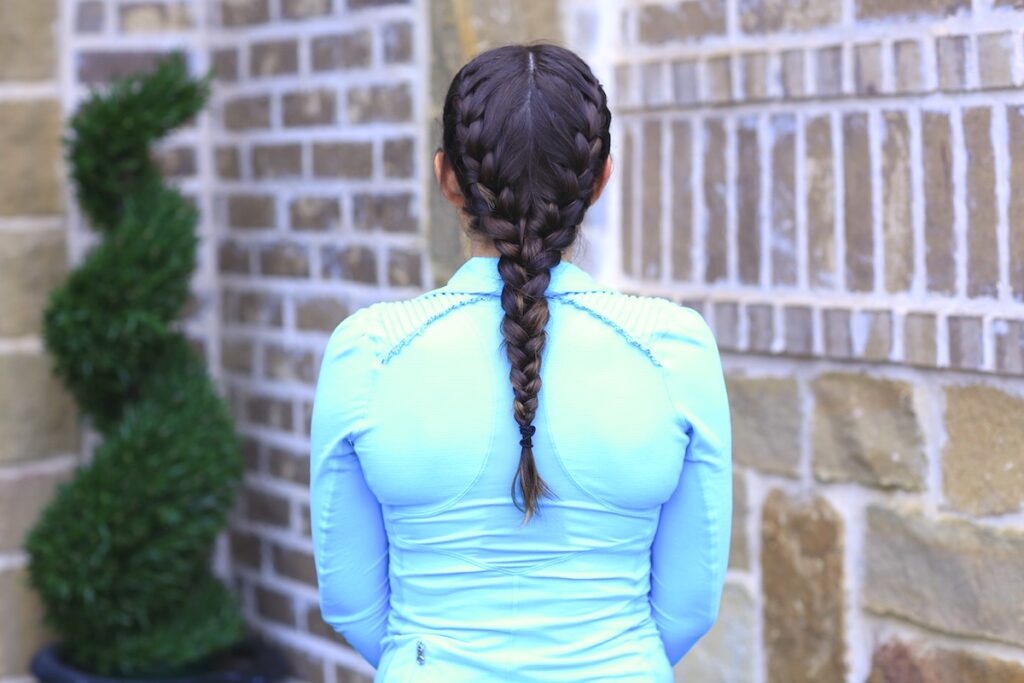 Woman standing outside modeling Boxer Braids No-Heat Curls