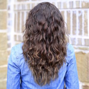 Woman standing outside modeling Boxer Braids No-Heat Curls